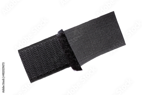 Contact tape isolated on white background, top view. Black velcro on a white background. Velcro fastener for clothes isolated on white background, top view. Black velcro, top view. photo