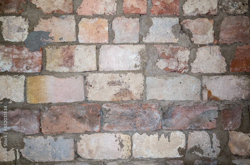 Fototapeta premium Texture background from an old unplastered brick wall