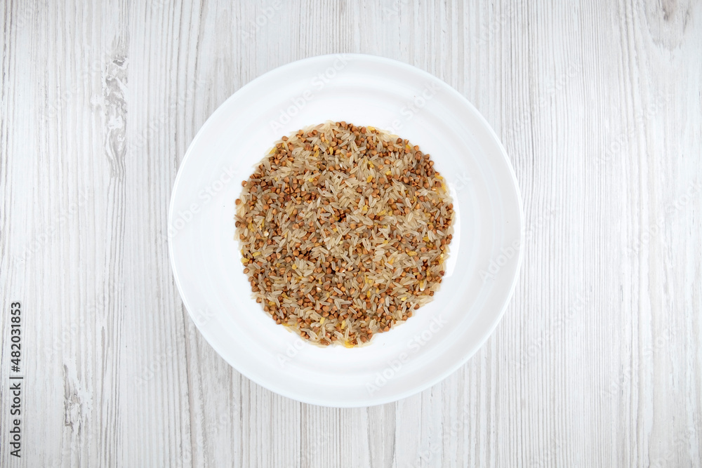cereals on the table. buckwheat, rice, bulgur in a bowl. porridge mix cereals on the table. buckwheat, rice, bulgur in a bowl. porridge mix