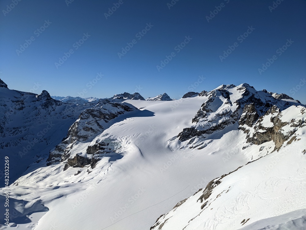 View on the Gemsfairenstock and in the background the Mountain Clariden. Day of ski touring in the Glarner Alps.