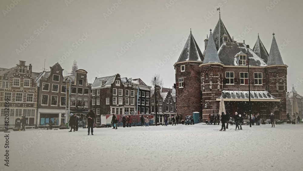 Old vintage photo from the Nieuwmarkt in Amsterdam the Netherlands in winter