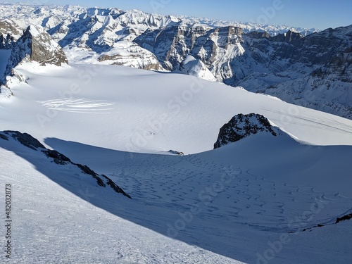beautiful deep snow tracks from the clariden mountain down towards the glacier firn. Uri Glarus Switzerland