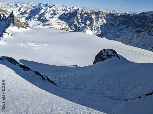 beautiful deep snow tracks from the clariden mountain down towards the glacier firn. Uri Glarus Switzerland photo