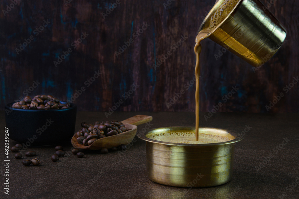Serving filter coffee in a brass cup Stock-Foto | Adobe Stock