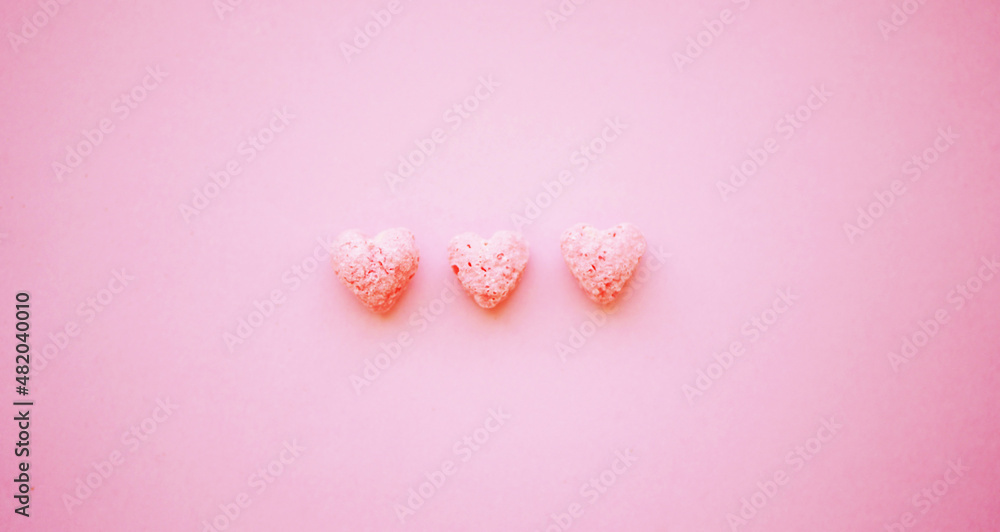Heart-shaped cereals flat lay. Minimalistic Valentines day greeting card Heart-shaped cereals flat lay. Minimalistic Valentines day greeting card