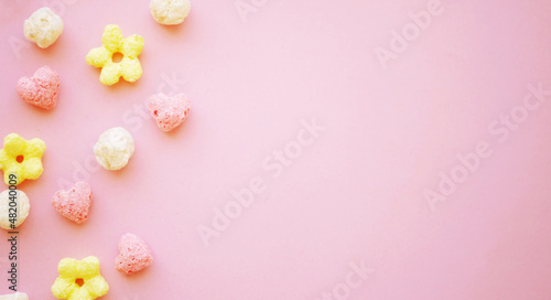 Cute flower cereals flat lay banner. Heart-shaped food. 