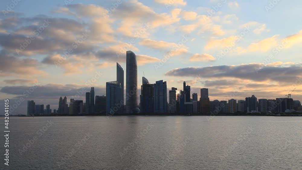 Abu Dhabi silhouetted cityscape on a cloudy winter morning at the sunrise Abu Dhabi silhouetted cityscape on a cloudy winter morning at the sunrise
