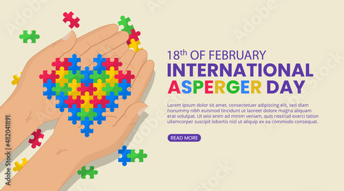Asperger day background with child hands and an arranged puzzles heart photo
