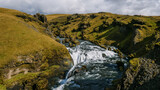 Icelandic landscape with a view of the waterfall and mountains