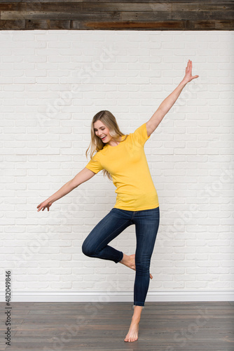 Heather Yellow Gold Graphic T-shirt Bella Canvas 3001 Blank Mockup Tee Female Blonde Smiling Woman Model 