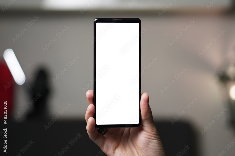 Person holding long smartphone. Mockup screen.