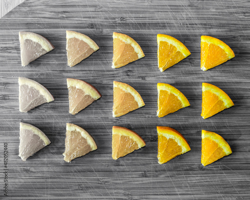 Orange slices on a cutting board, b/w food photography