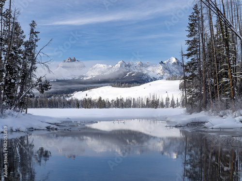 Sawtooth Mountains reflection in winter at Little Redfish Lake