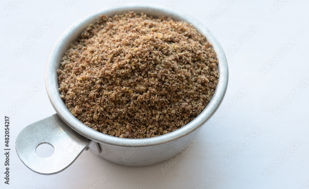 Ground Flaxseed in a Measuring Cup Ground Flaxseed in a Measuring Cup