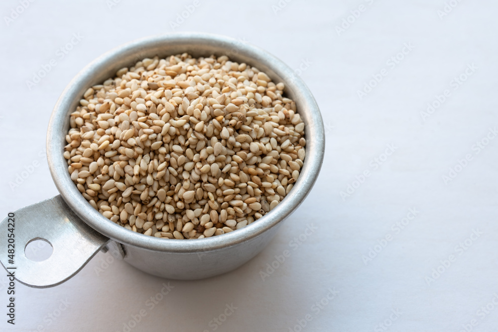 Toasted Sesame Seeds in a Measuring Cup Toasted Sesame Seeds in a Measuring Cup
