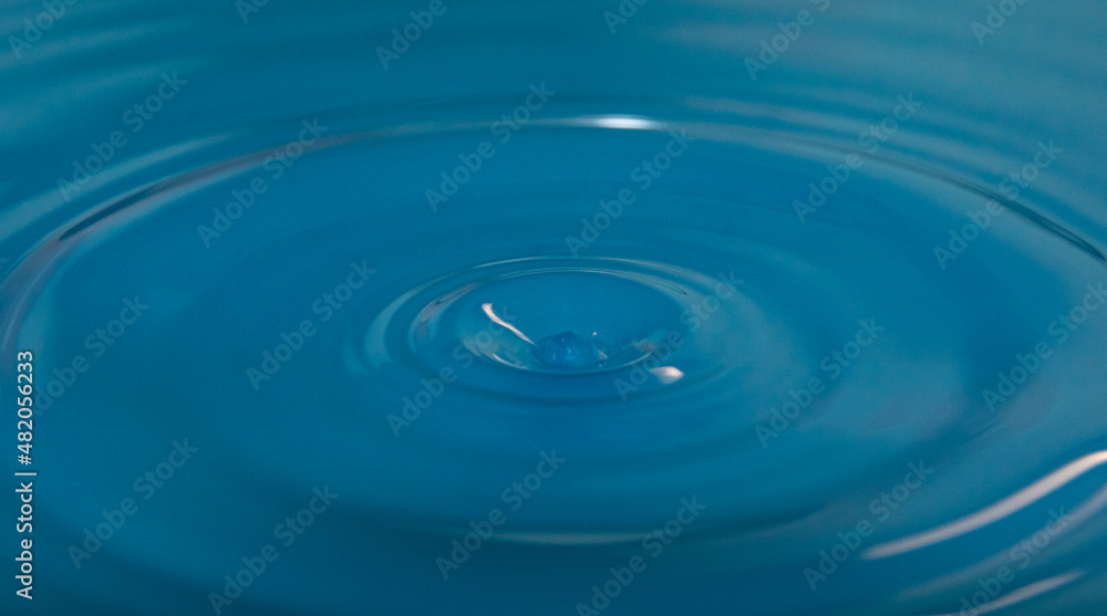water droplet falls into water with ripples water droplet falls into water with ripples