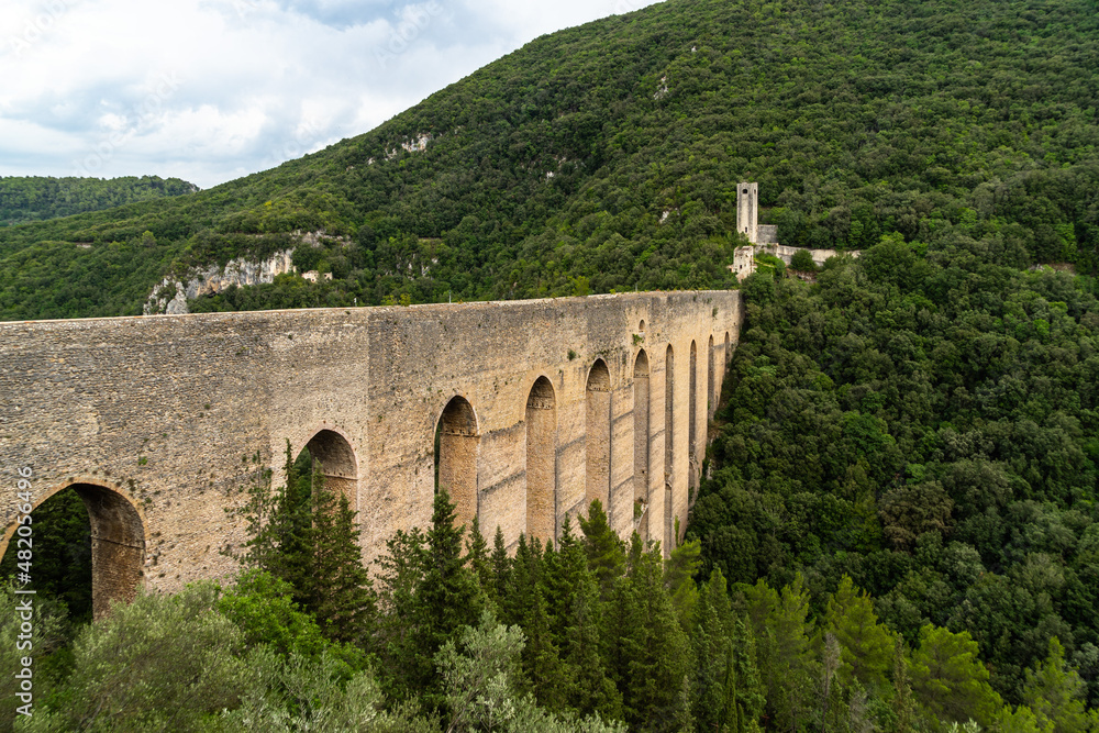 The scenic aqueduct “Ponte delle Torri” in Spoleto, surrounded by a scenic natural landscape, Umbria, Italy