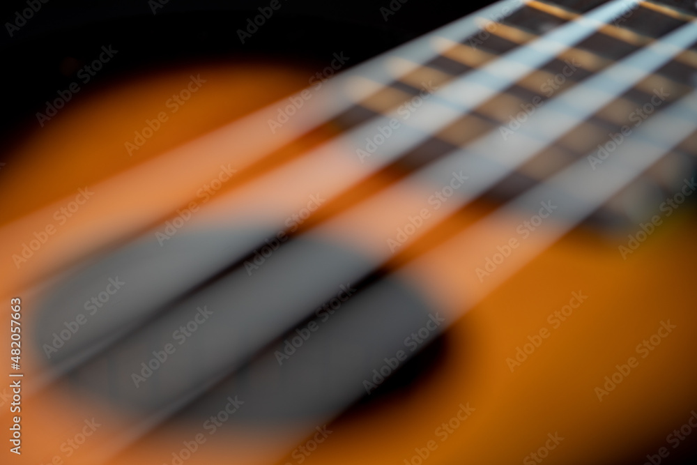 Fototapeta premium Blurred Ukulele. Defocused image of Ukulele.