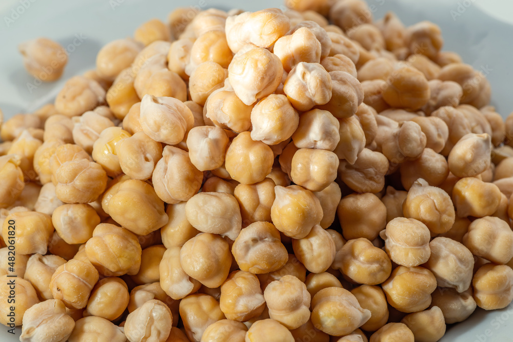Chickpea or chick pea Cicer arietinum annual legume for cooking hummus. Garbanzo beans seeds for nutrient-dense healthy vegetarian food Chickpea or chick pea Cicer arietinum annual legume for cooking hummus. Garbanzo beans seeds for nutrient-dense healthy vegetarian food