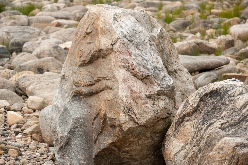 Fototapeta premium Stones on shore of lake in summer, Karelia, Russia