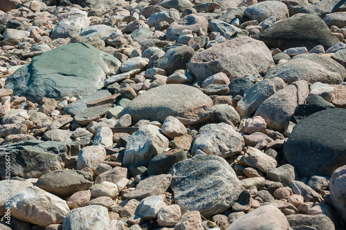 Stones on shore of lake in summer, Karelia, Russia