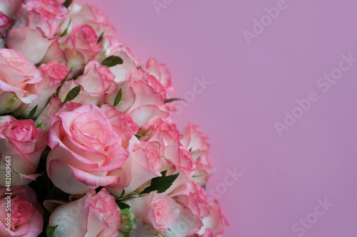 beautiful bouquet of pink roses on pink background. Mother's day, Valentines Day, 8 march. Birthday celebration concept. Greeting card. Copy space, top view © Eleanora