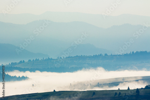 mountain landscape on a foggy morning. beautiful autumnal nature scenery © Pellinni