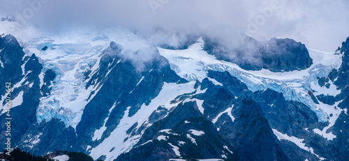 snow covered mountains in winter with glaciers