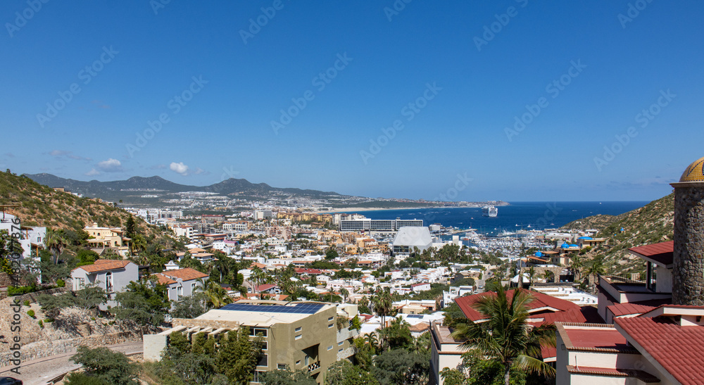 panorama overview of the city of Cabo San Lucas with harbor in the background