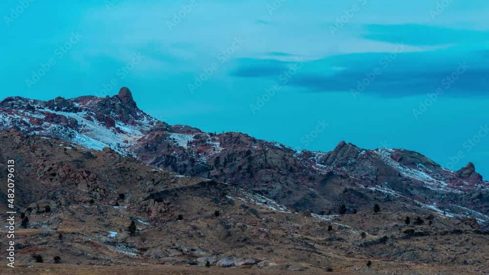 time lapse view of mountain peak during a winter sunset in Wyoming time lapse view of mountain peak during a winter sunset in Wyoming