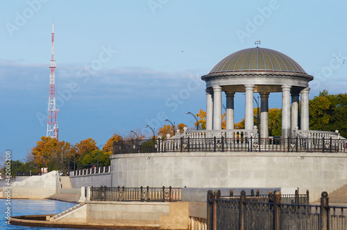 Rotunda on the embankment of the city of Blagoveshchensk, Russia in autumn 2021. Increased water level in the Amur River after the summer flood.  photo