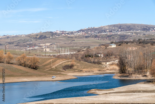 A partially frozen lake near the city of Shamakhi, Azerbaijan. photo