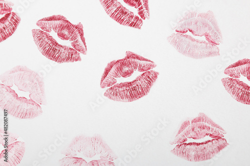 Red lipstick marks on a white background. Kiss symbol. Minimal love concept.Flat lay.