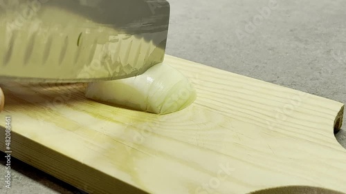 italina man cutting an onion