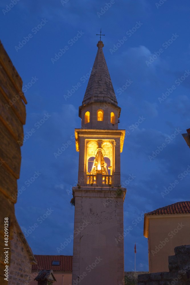 Night view of the bell tower of the St Ivan church in the old town of Budva