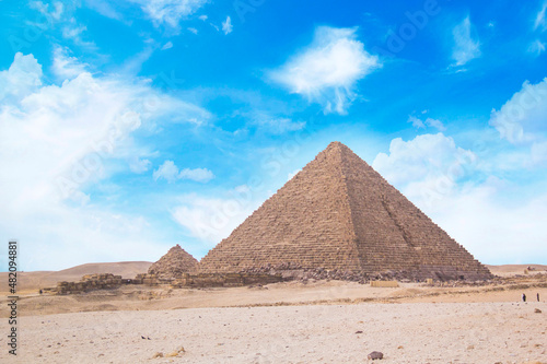 Great Sphinx against the background of the pyramids of the pharaohs Cheops  Khafren  and Mikerin in Giza  Egypt