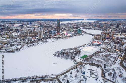 Yekaterinburg aerial panoramic view at Winter in beautiful cloudy sunset. Ekaterinburg is the fourth largest city in Russia located in the Eurasian continent on the border of Europe and Asia.