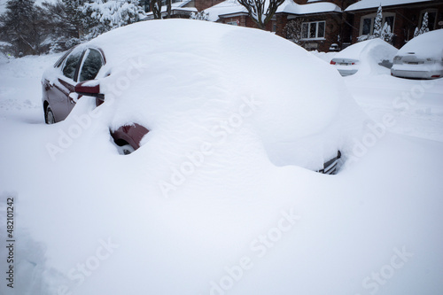 Toronto, Ontario / Canada - January 17, 2022 - Toronto St Clair West car covered with snow on day of snowstorm