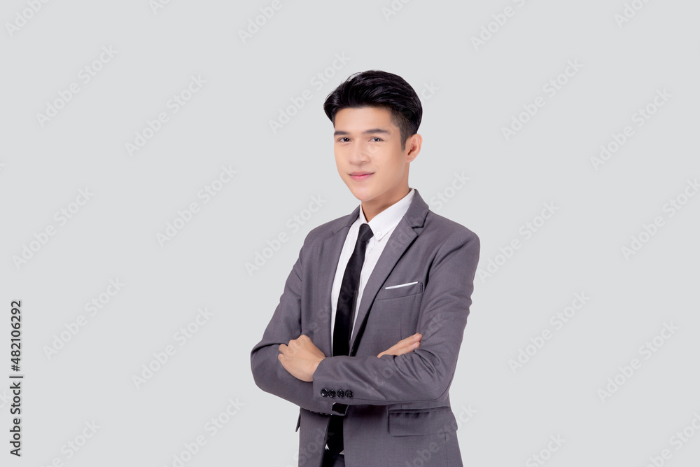Portrait businessman in suit with crossed his arms standing isolated on white background, young asian business man is manager or executive having confident is positive with success. Portrait businessman in suit with crossed his arms standing isolated on white background, young asian business man is manager or executive having confident is positive with success.