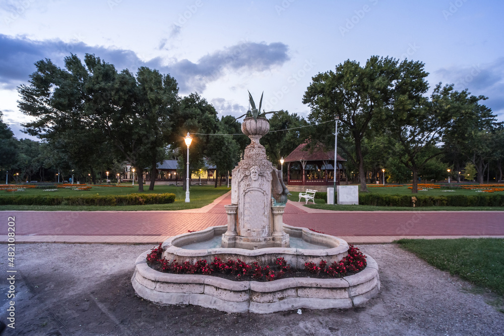 17th century water fountain of the Palic Lake, in Subotica, Serbia during a summer sunset in front of velika terasa. Also known as Palicko Jezero, it is the main attractions of Vojvodina province 17th century water fountain of the Palic Lake, in Subotica, Serbia during a summer sunset in front of velika terasa. Also known as Palicko Jezero, it is the main attractions of Vojvodina province
