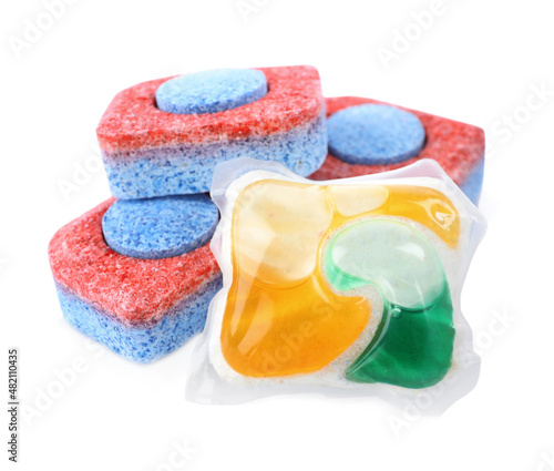 Dishwasher detergent pod and tablets on white background