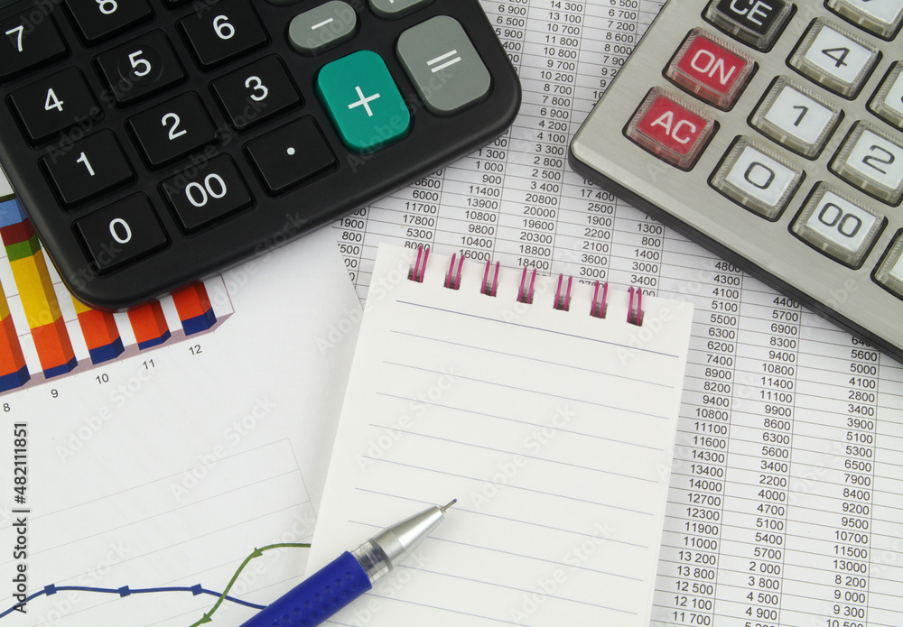 Business, financial data and counting concept. Calculators, pen and notebook on financial documents. Business, financial data and counting concept. Calculators, pen and notebook on financial documents.
