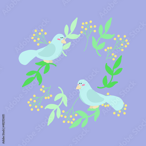 Two birds sit on a spring wreath