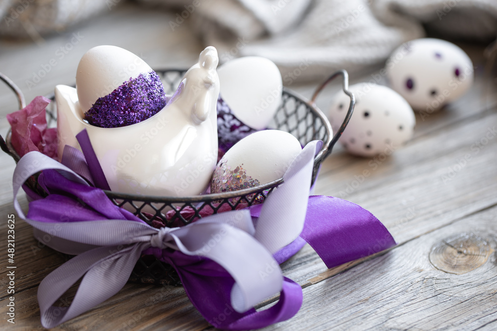 Easter composition with eggs, decorated with purple sparkles. Easter composition with eggs, decorated with purple sparkles.