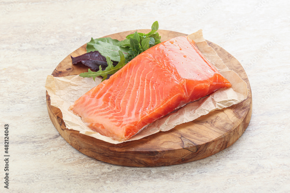 Raw salmon fillet over board Raw salmon fillet over board