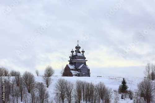 wooden church in the Russian north landscape in winter, architecture historical religion Christianity photo