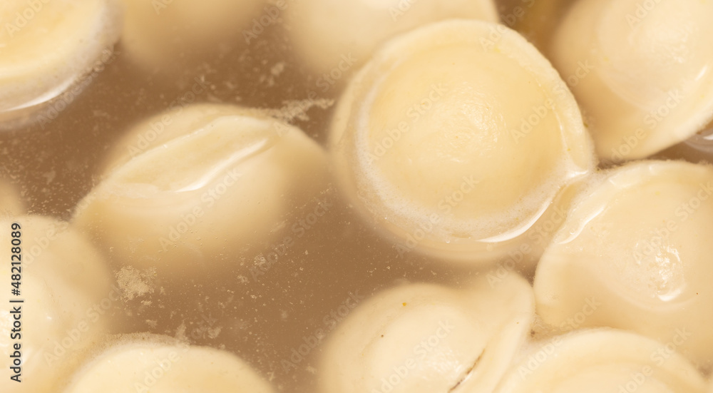 Dumplings made from dough and meat are boiled in boiled water. Dumplings made from dough and meat are boiled in boiled water.