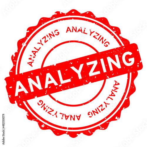 Grunge red analyzing word round rubber seal stamp on white background