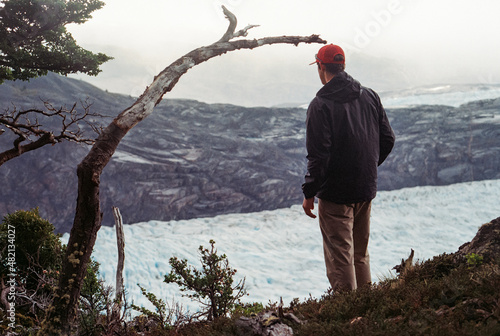 person looking upon a glacier