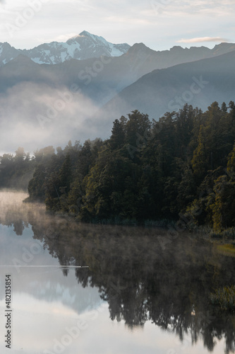 Early and misty morning at lake Matheson New Zealand